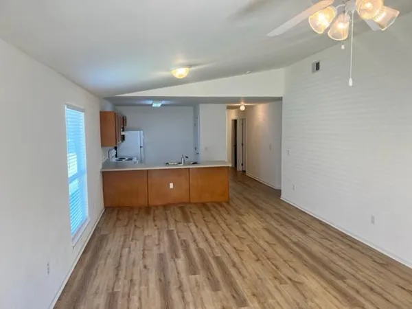 a view of kitchen with wooden floor and window