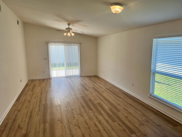 68 7th Avenue Shalimar, FL 32579 - Photo 4 of 11 wooden floor in an empty room with a window