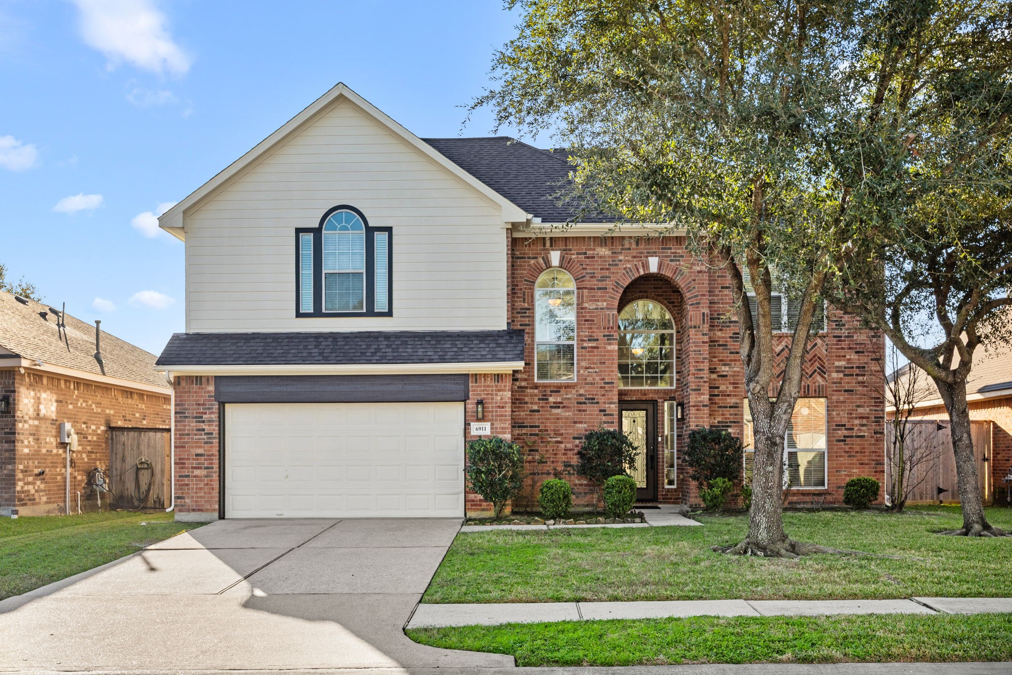 6911 Hamilton Falls Lane Spring, TX 77379 - Photo 1 of 42 a front view of a house with a yard