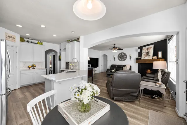 a kitchen with a sink appliances cabinets and counter space