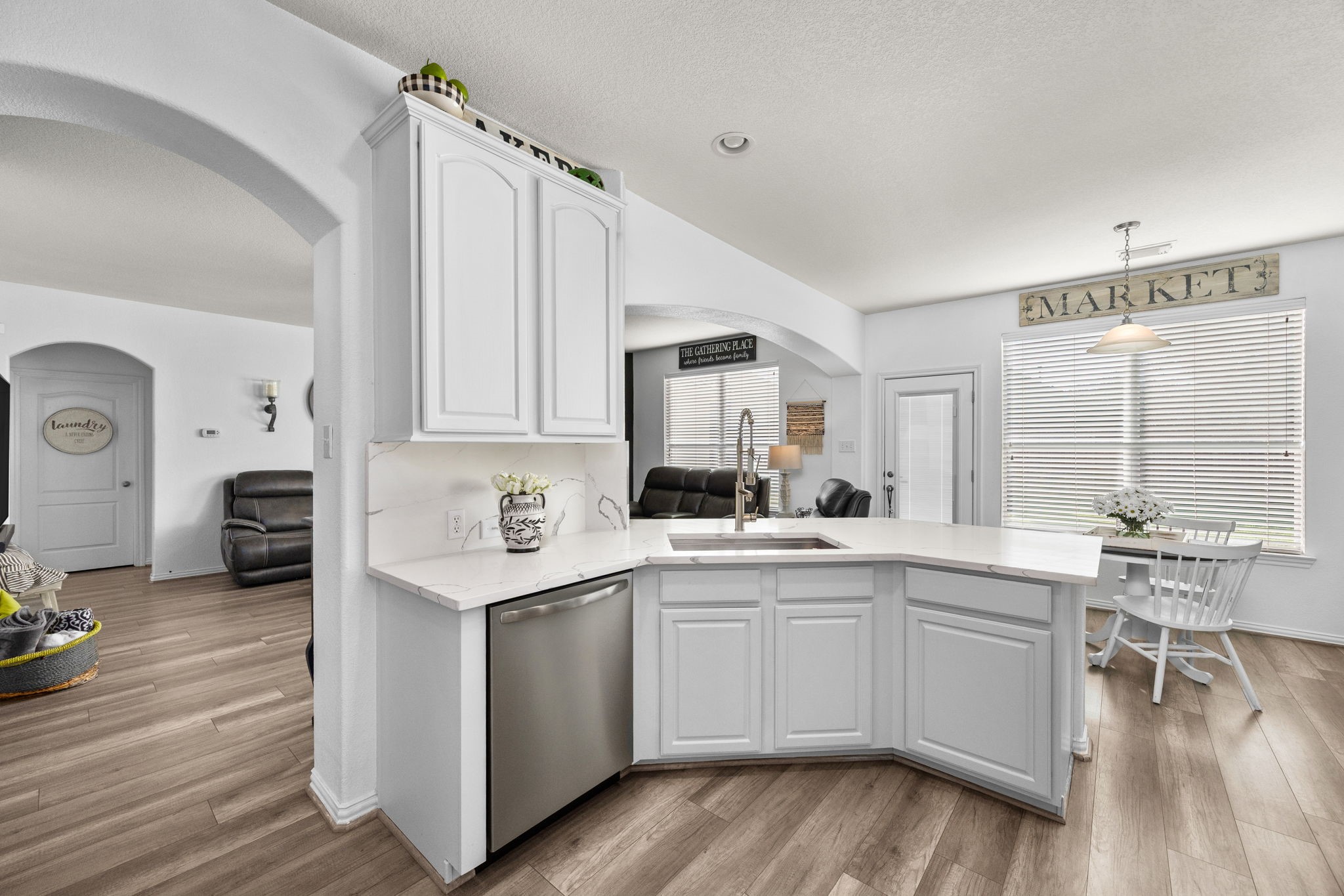6911 Hamilton Falls Lane Spring, TX 77379 - Photo 16 of 42 a kitchen with a sink cabinets and wooden floor