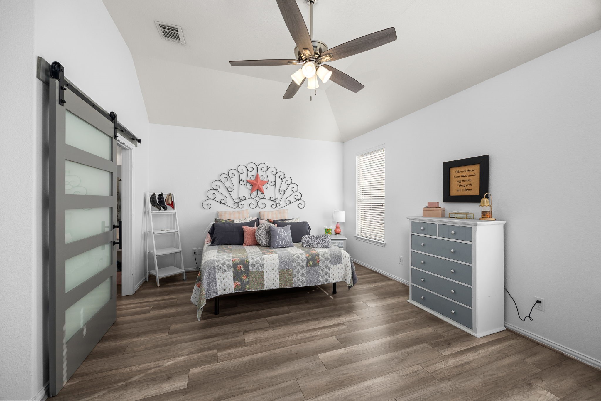 6911 Hamilton Falls Lane Spring, TX 77379 - Photo 20 of 42 a bedroom with furniture and a wooden floor