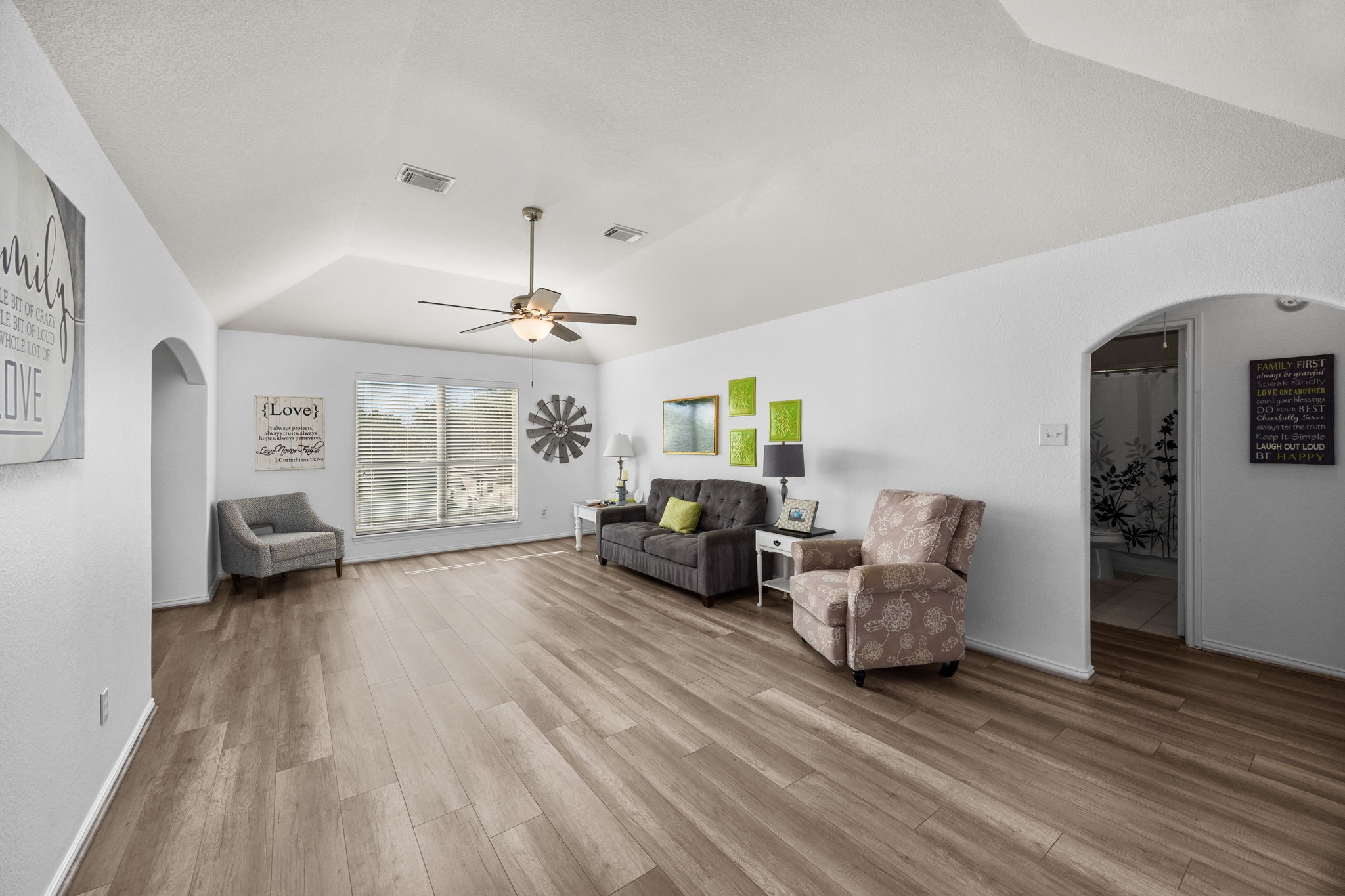 6911 Hamilton Falls Lane Spring, TX 77379 - Photo 28 of 42 a living room with furniture and a chandelier