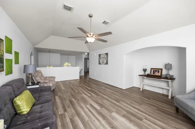 a bedroom with a bed and flat screen tv