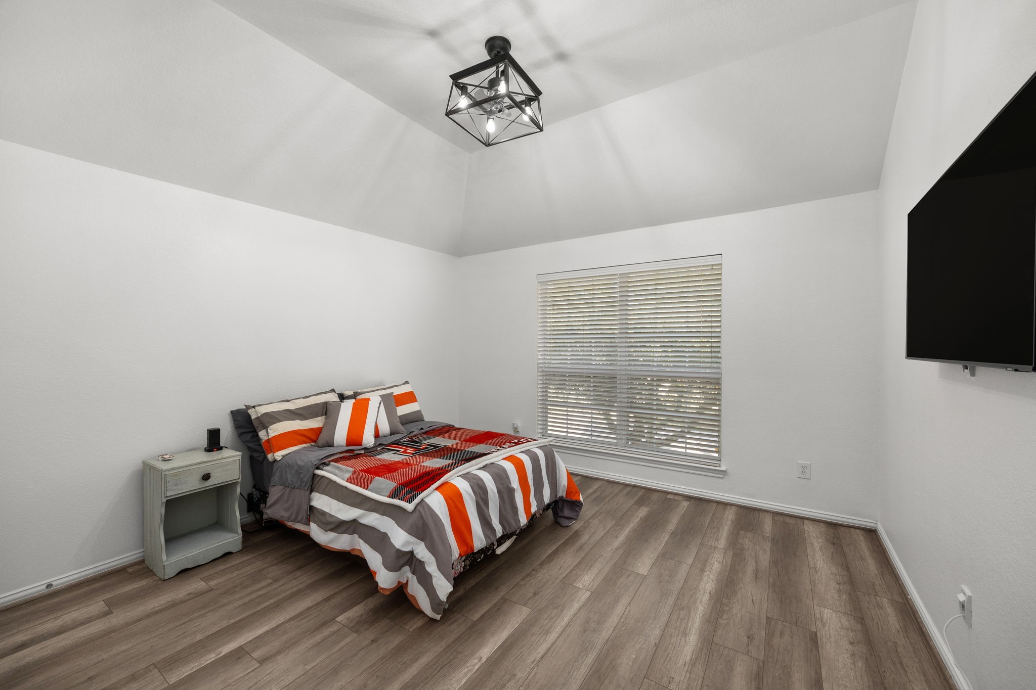 6911 Hamilton Falls Lane Spring, TX 77379 - Photo 30 of 42 a bedroom with a bed and flat screen tv