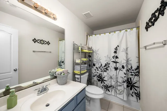 a spacious bedroom with a bed and a couch