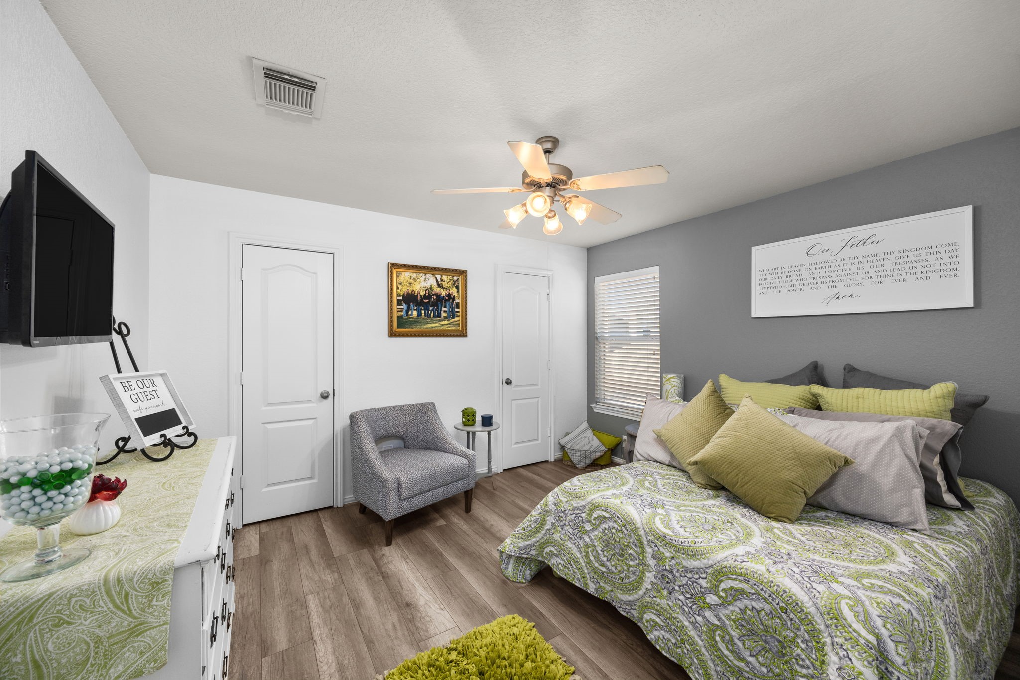 6911 Hamilton Falls Lane Spring, TX 77379 - Photo 32 of 42 a spacious bedroom with a bed and a couch