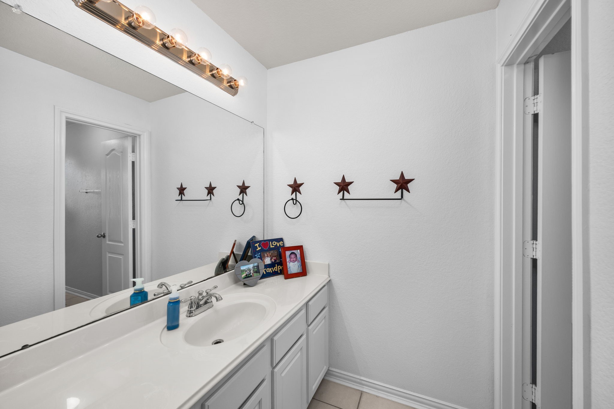 6911 Hamilton Falls Lane Spring, TX 77379 - Photo 35 of 42 a bathroom with a sink and a mirror