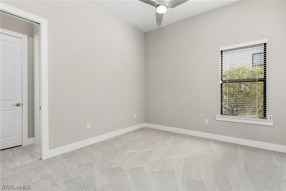 16257 Verilyn Circle Naples, FL 34110 - Photo 31 of 40 an empty room with a window