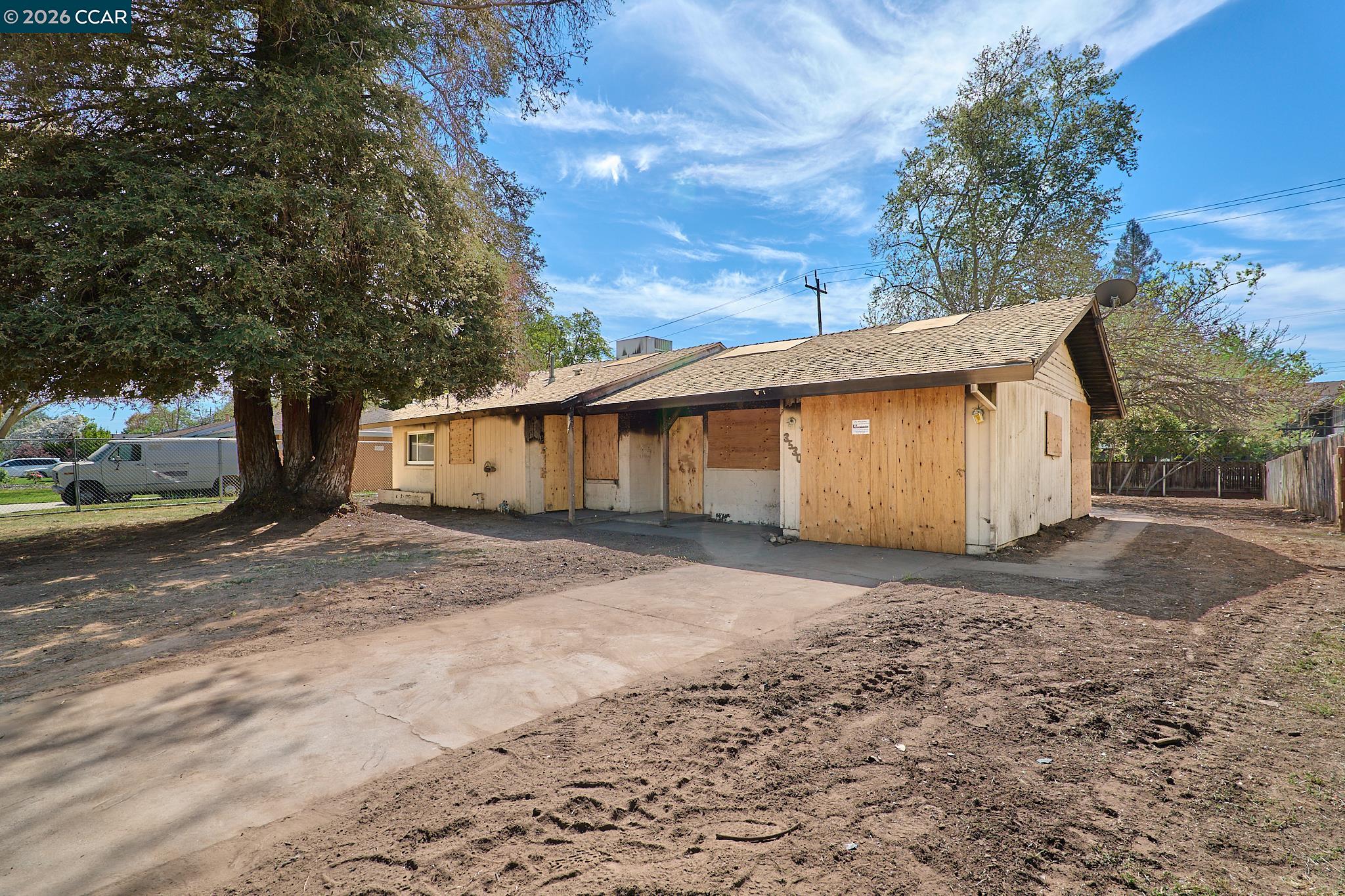 3530 William Way Sacramento, CA 95821 - Photo 2 of 27 a view of a house with a yard and garage