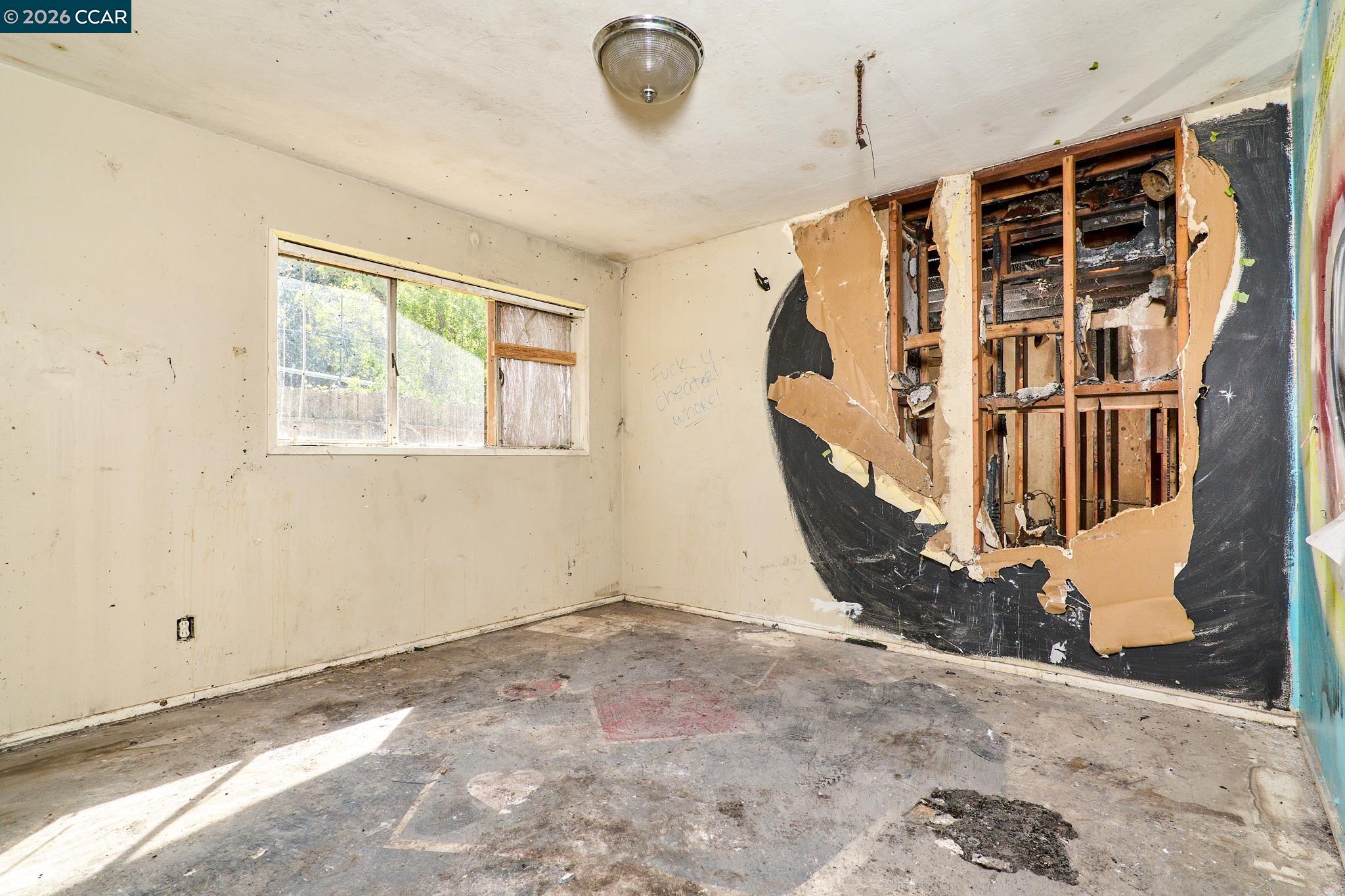3530 William Way Sacramento, CA 95821 - Photo 7 of 27 a view of an empty room with wooden floor and windows