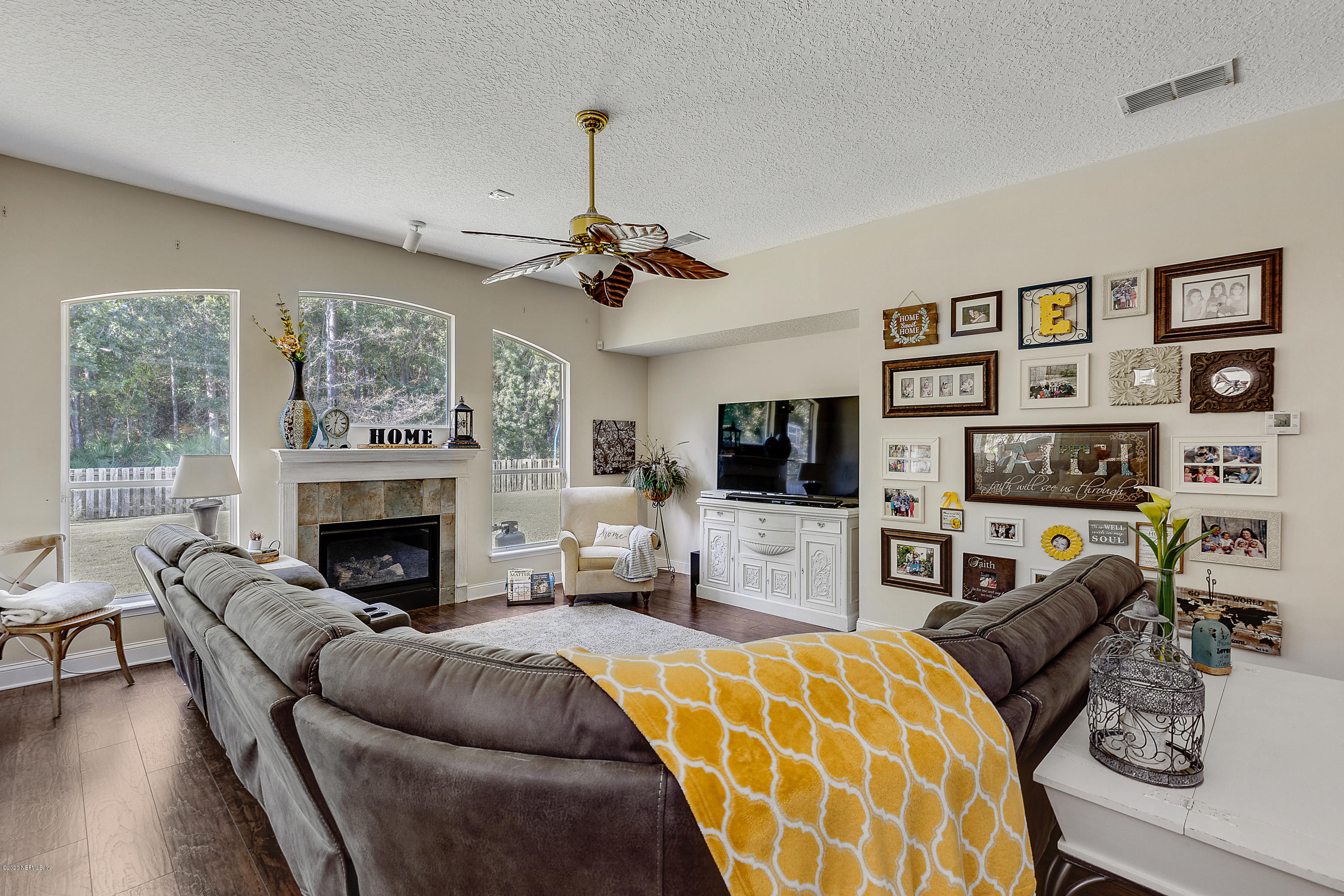 1798 Covington Lane Fleming Island, FL 32003 - Photo 14 of 30 a living room with furniture and a flat screen tv