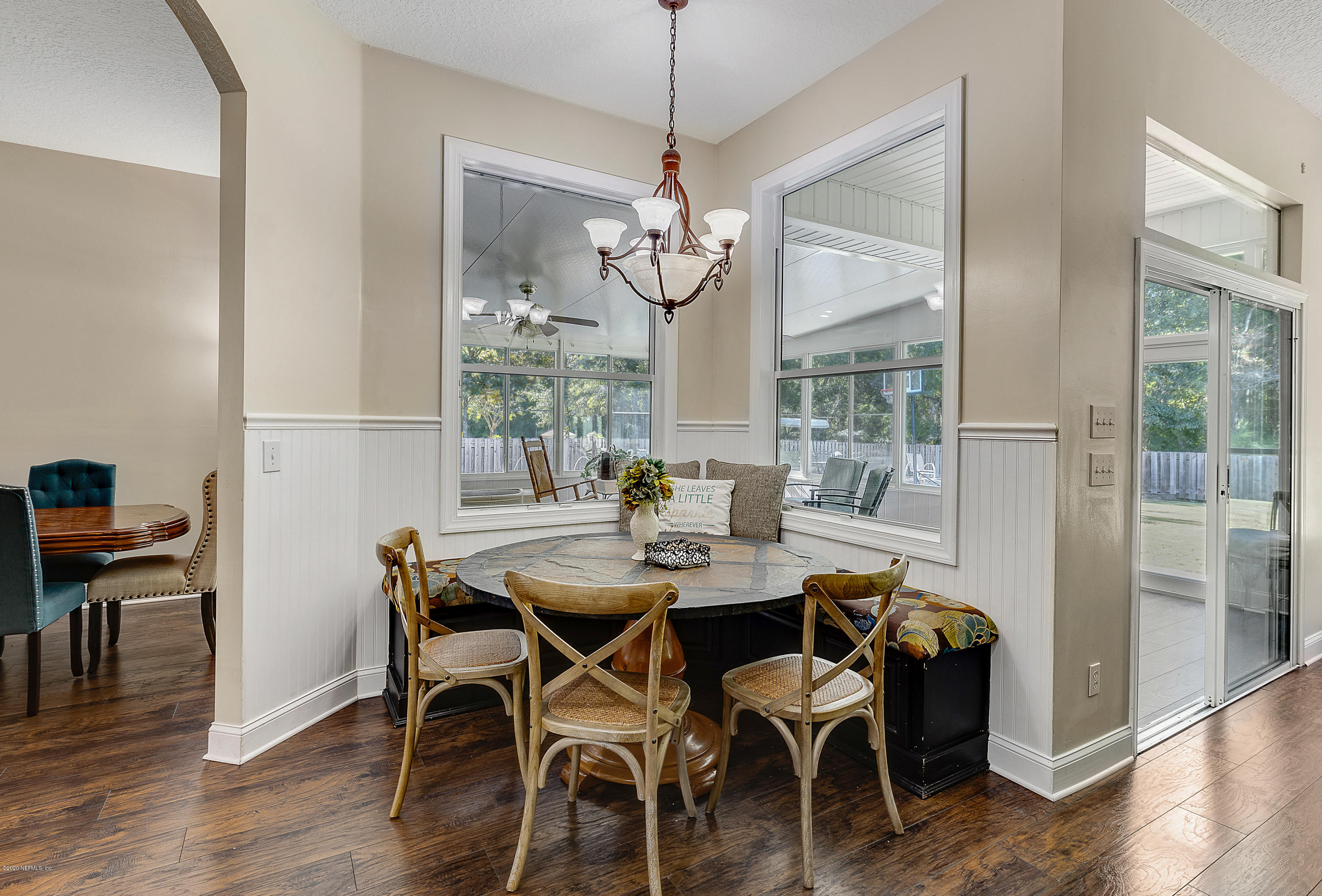 1798 Covington Lane Fleming Island, FL 32003 - Photo 15 of 30 a view of a dining room with furniture window and wooden floor