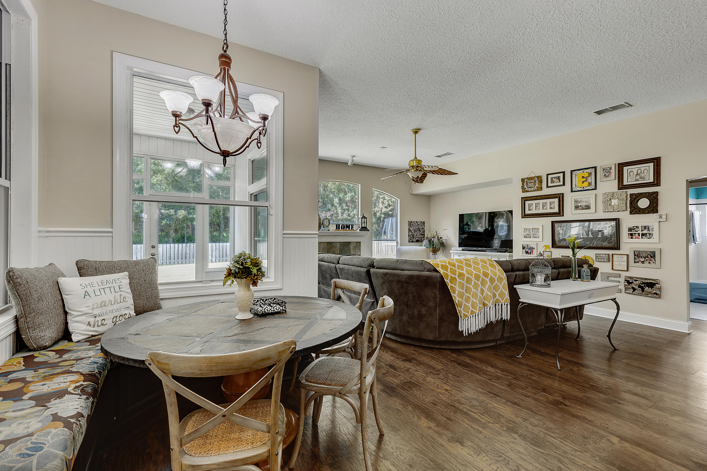 1798 Covington Lane Fleming Island, FL 32003 - Photo 16 of 30 a view of a dining room with furniture window and wooden floor