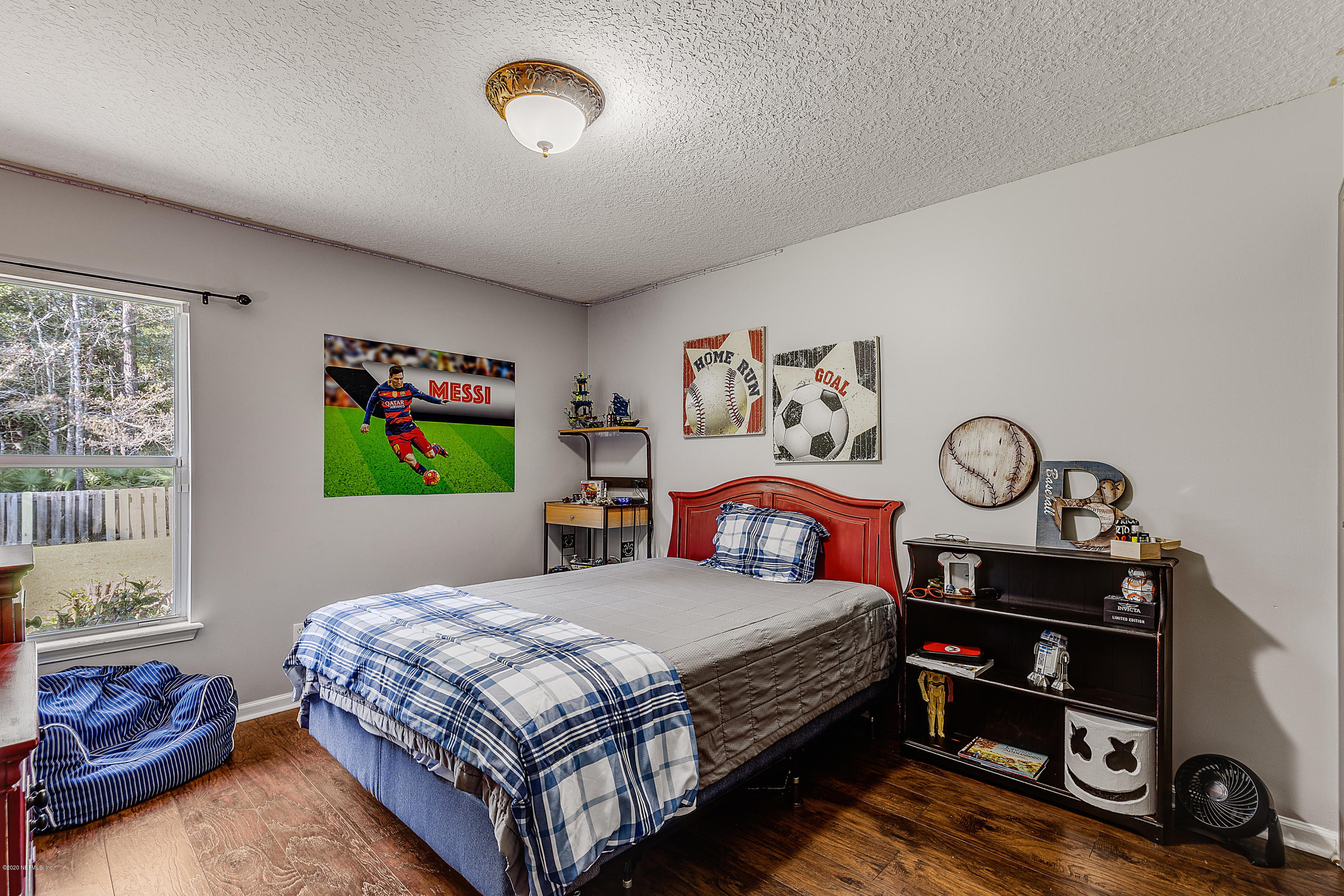 1798 Covington Lane Fleming Island, FL 32003 - Photo 19 of 30 a bedroom with a bed and a closet