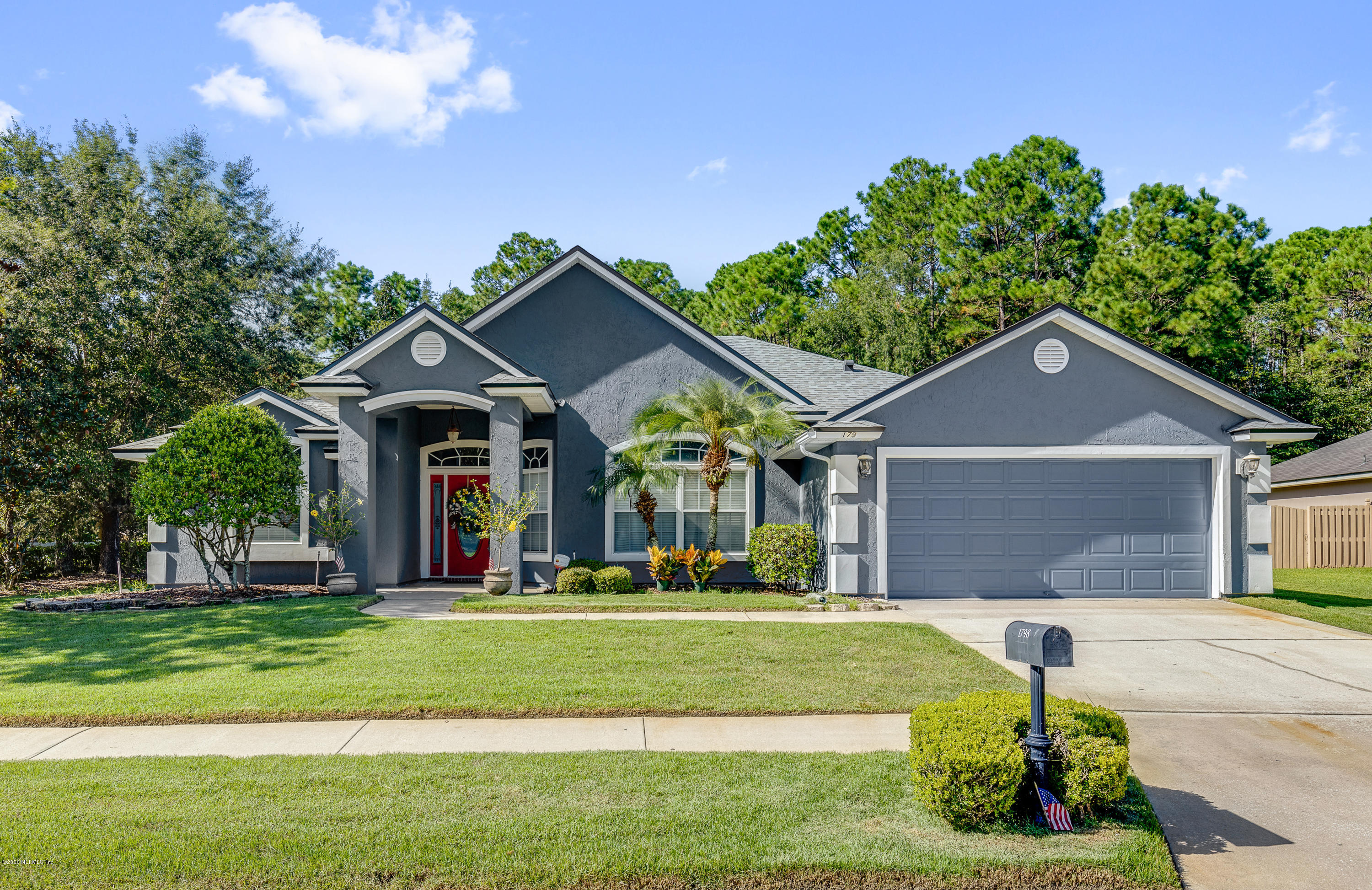 1798 Covington Lane Fleming Island, FL 32003 - Photo 2 of 30 a front view of a house with a yard