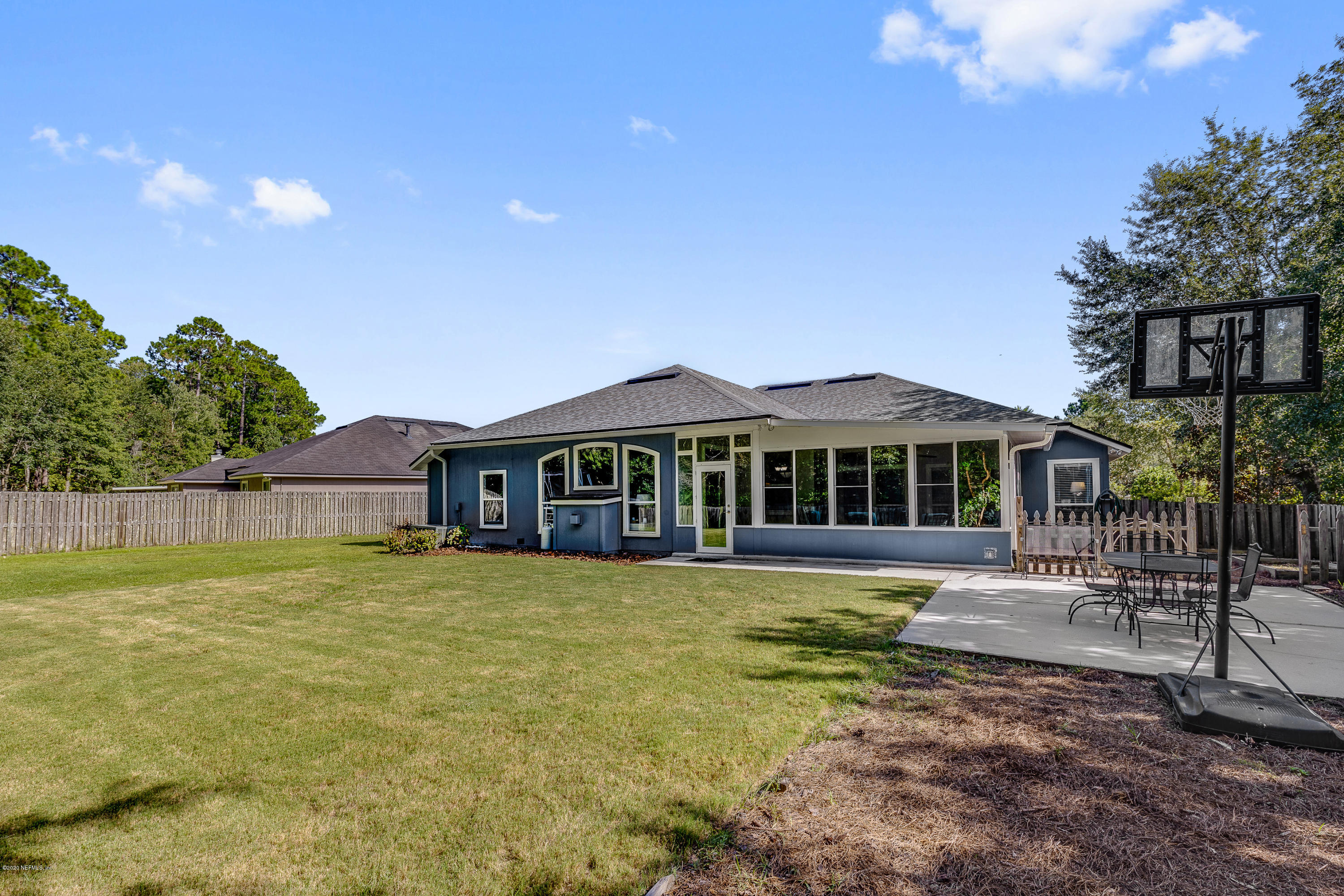 1798 Covington Lane Fleming Island, FL 32003 - Photo 29 of 30 a front view of a house with a yard table and chairs