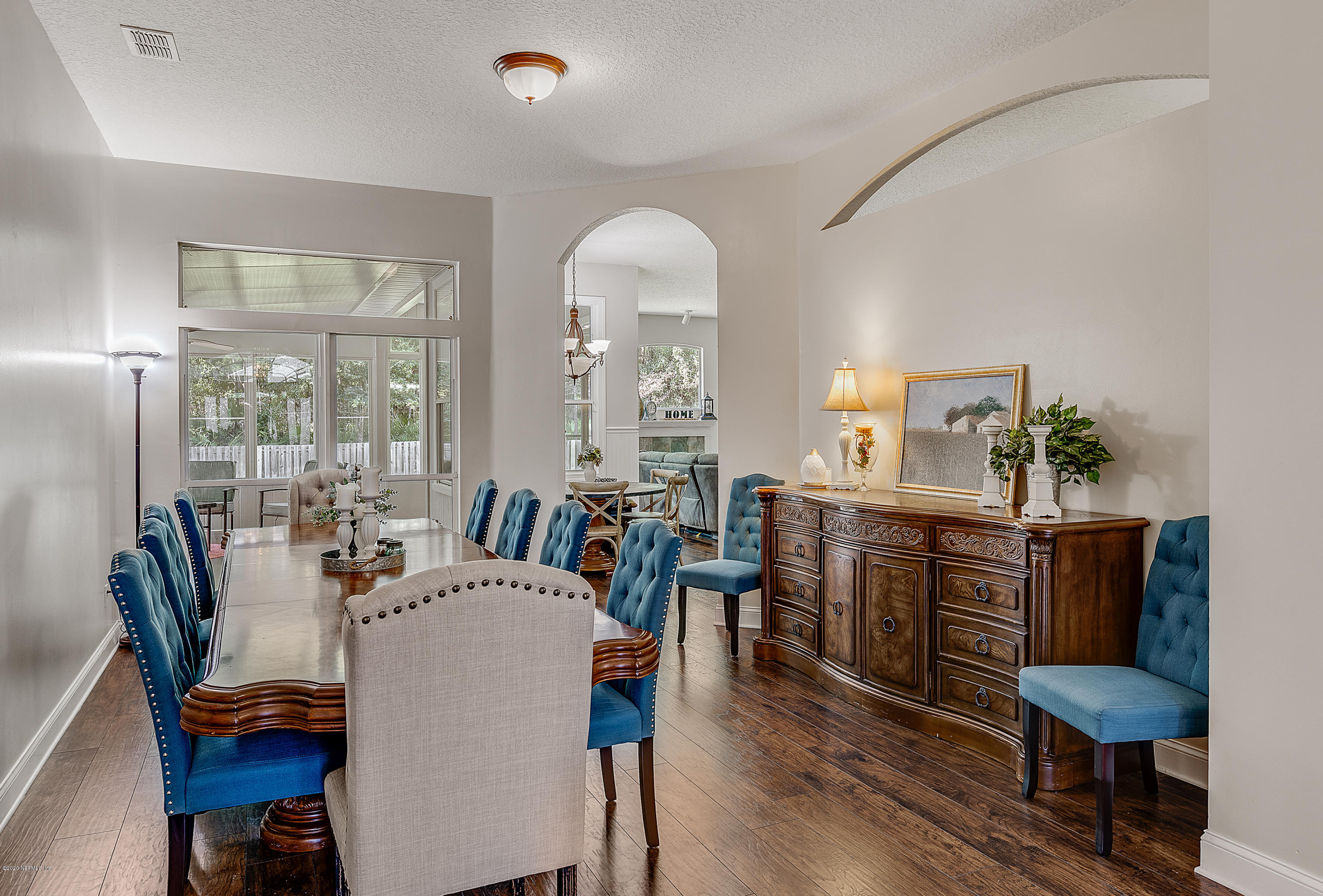 1798 Covington Lane Fleming Island, FL 32003 - Photo 8 of 30 a view of a a dining room with furniture window and wooden floor