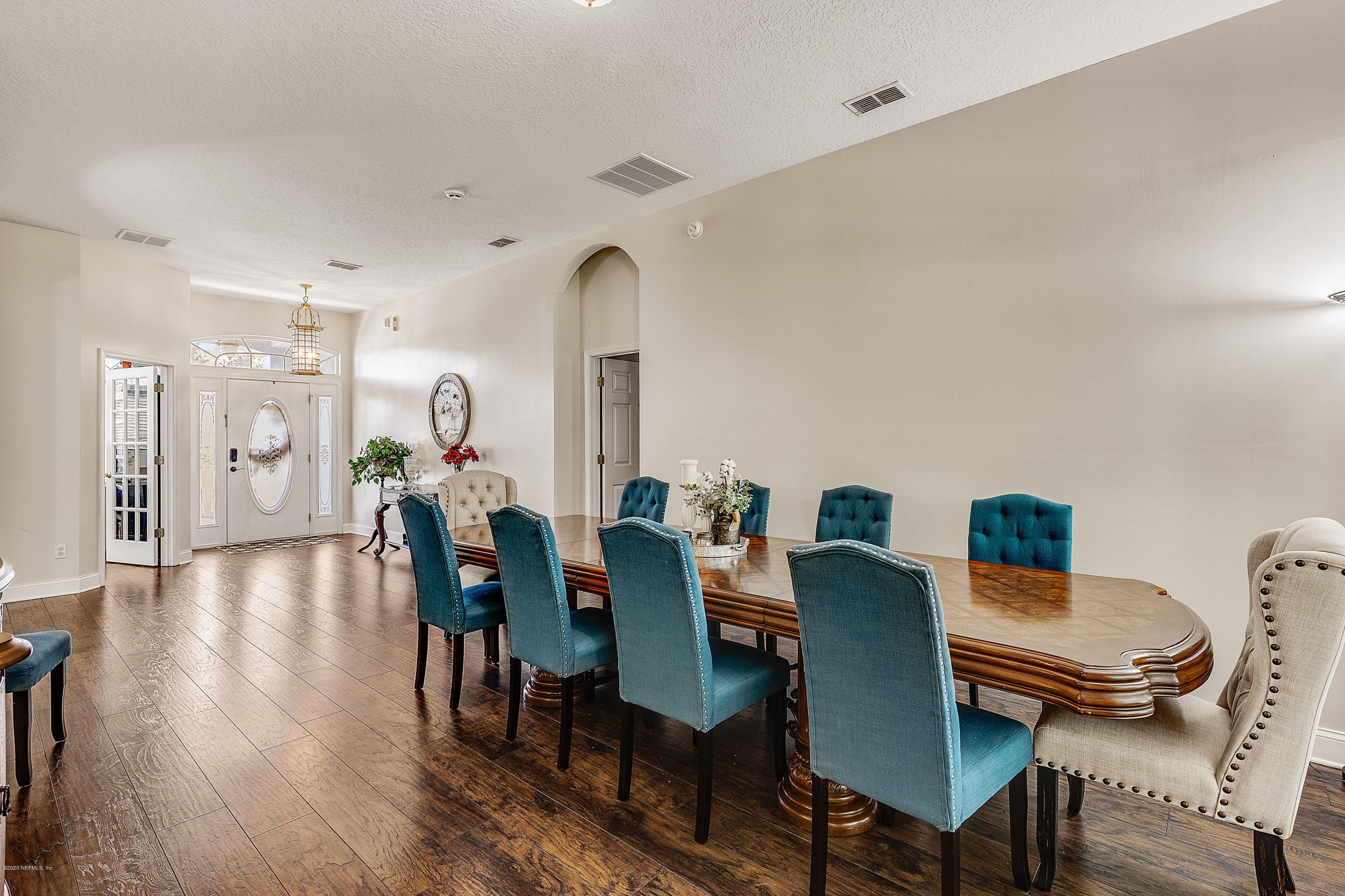 1798 Covington Lane Fleming Island, FL 32003 - Photo 9 of 30 a view of a dining room with furniture window and wooden floor