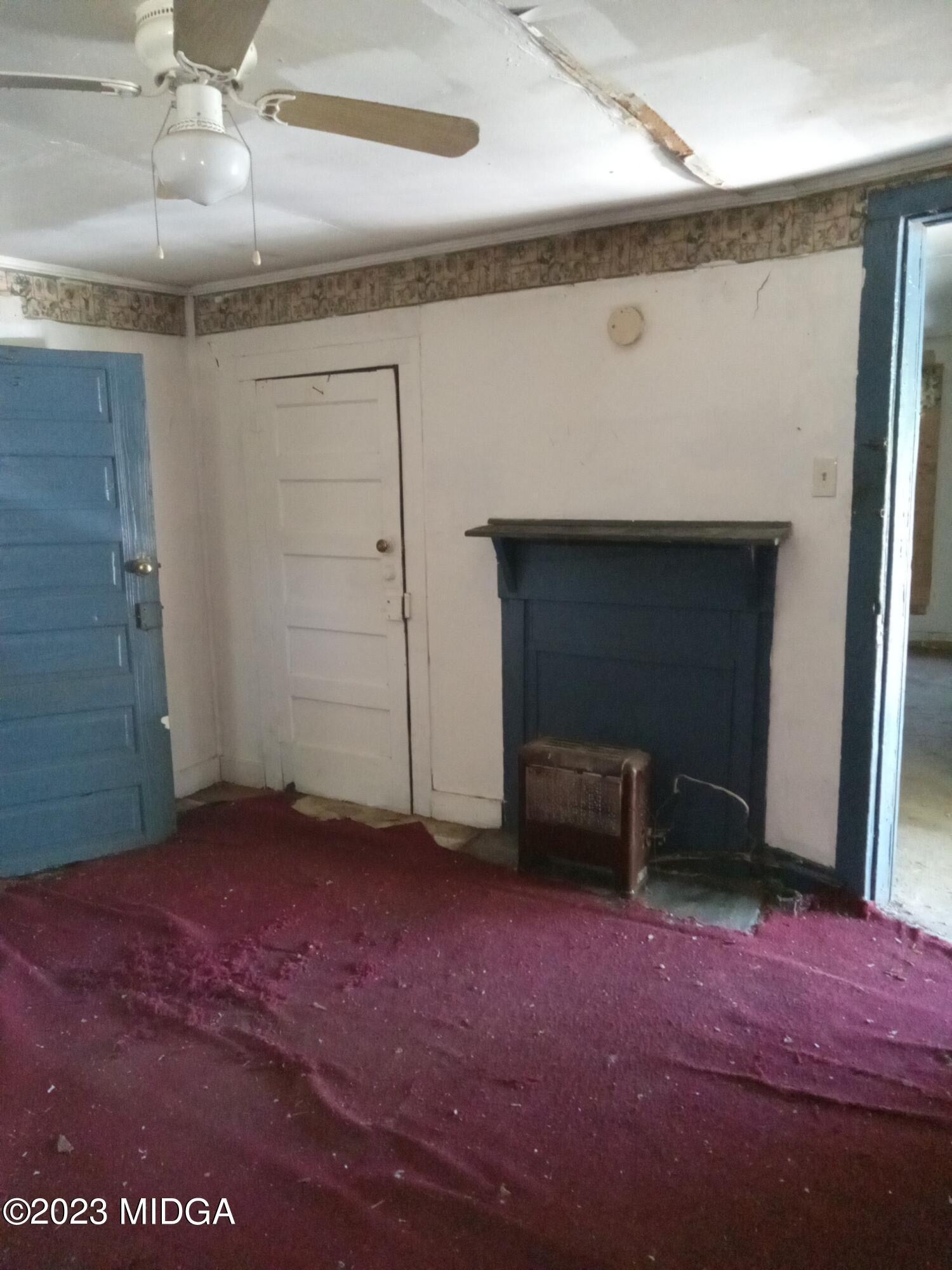 1123 Smith Street Macon, GA 31217 - Photo 14 of 17 an empty room with windows and cabinet
