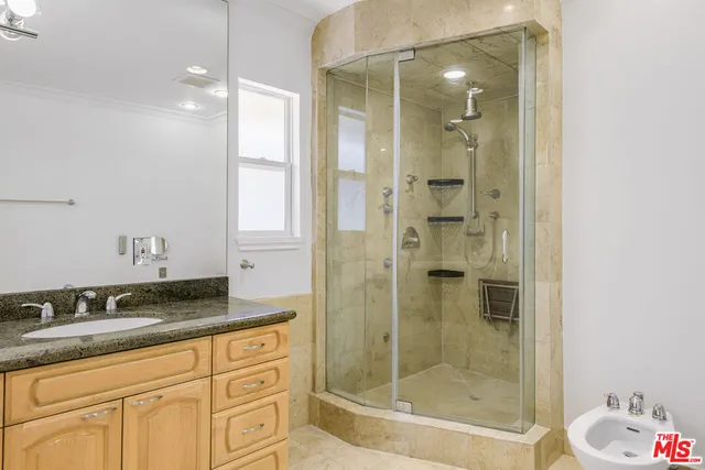 a view of empty room with a sink and a microwave