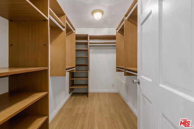 a room with pool table and windows