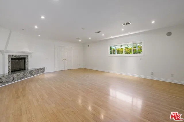 a swimming pool with outdoor seating and yard