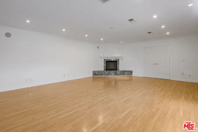 a view of a patio with table and chairs