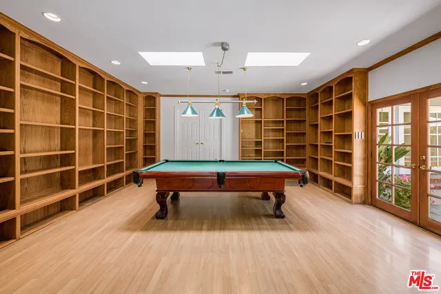 a view of a swimming pool with a lounge chair