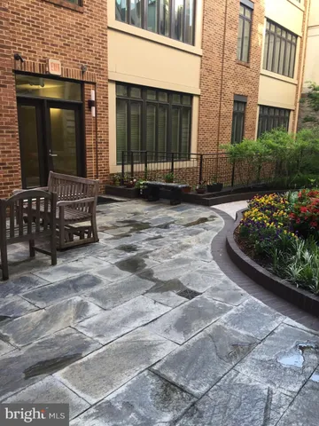 a view of a brick house with many windows