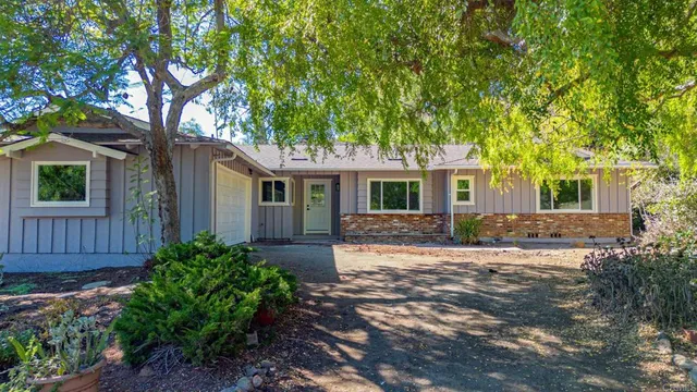 front view of a house with a yard