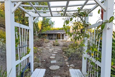a view of a house with a tree