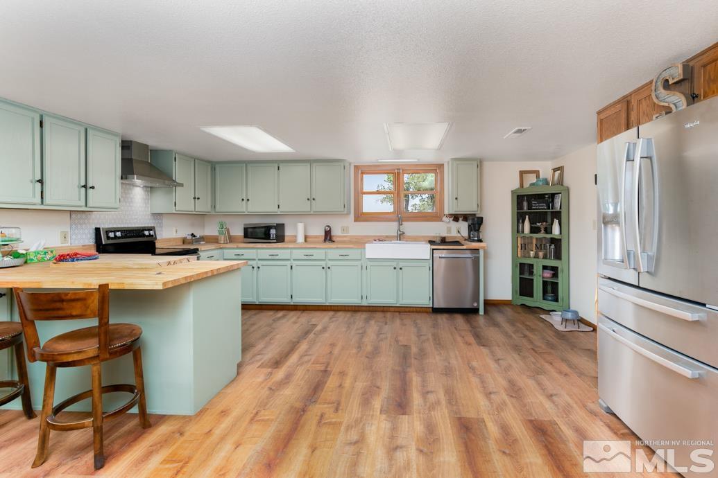 4740 St Clair Road Fallon, NV 89406 - Photo 9 of 40 a kitchen with a sink cabinets and stainless steel appliances