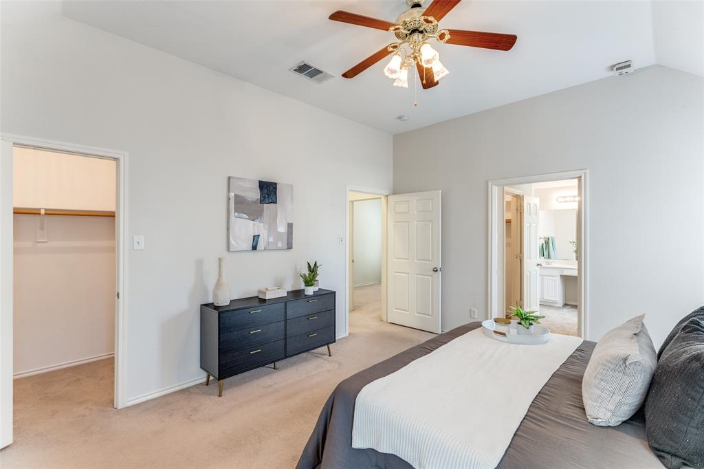 5213 Westheimer Road Fort Worth, TX 76244 - Photo 12 of 25 a bedroom with a bed and a chandelier