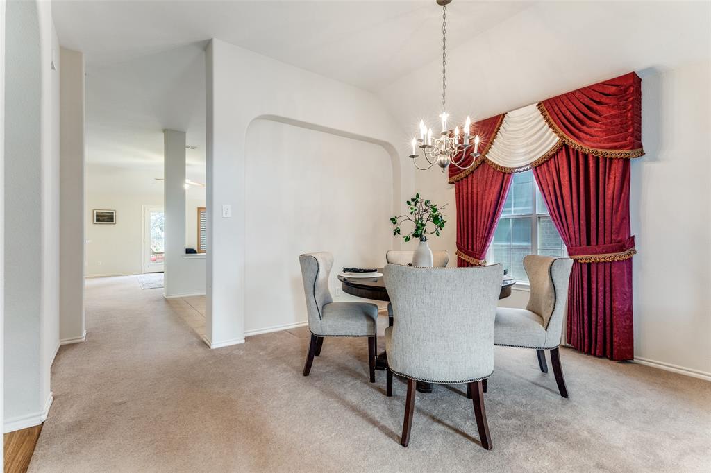 5213 Westheimer Road Fort Worth, TX 76244 - Photo 17 of 25 a view of a dining room with furniture and chandelier