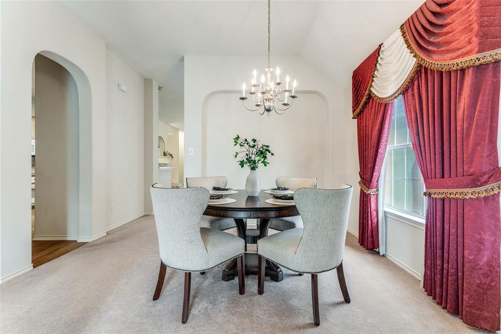 5213 Westheimer Road Fort Worth, TX 76244 - Photo 18 of 25 a view of a dining room with furniture and a chandelier