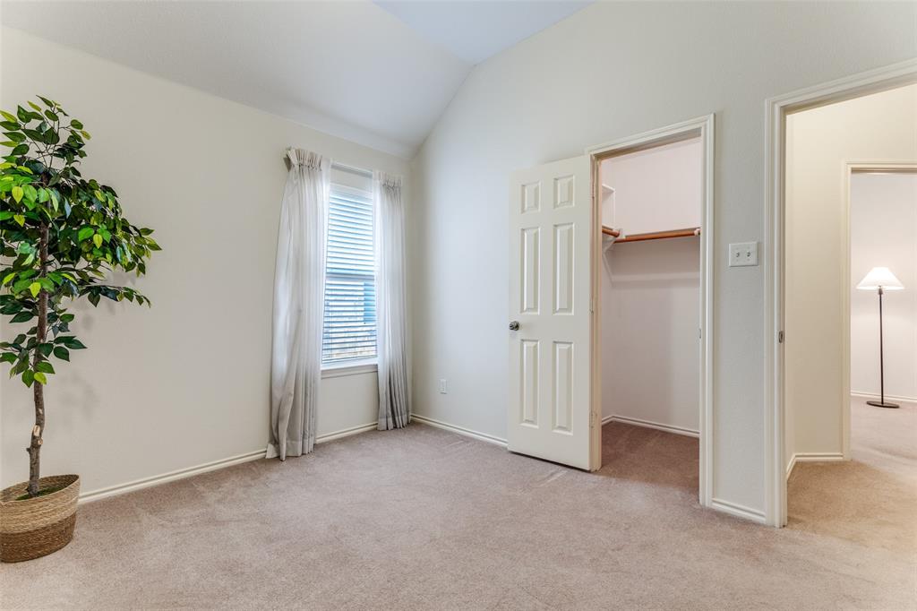 5213 Westheimer Road Fort Worth, TX 76244 - Photo 19 of 25 an empty room with windows and closet area
