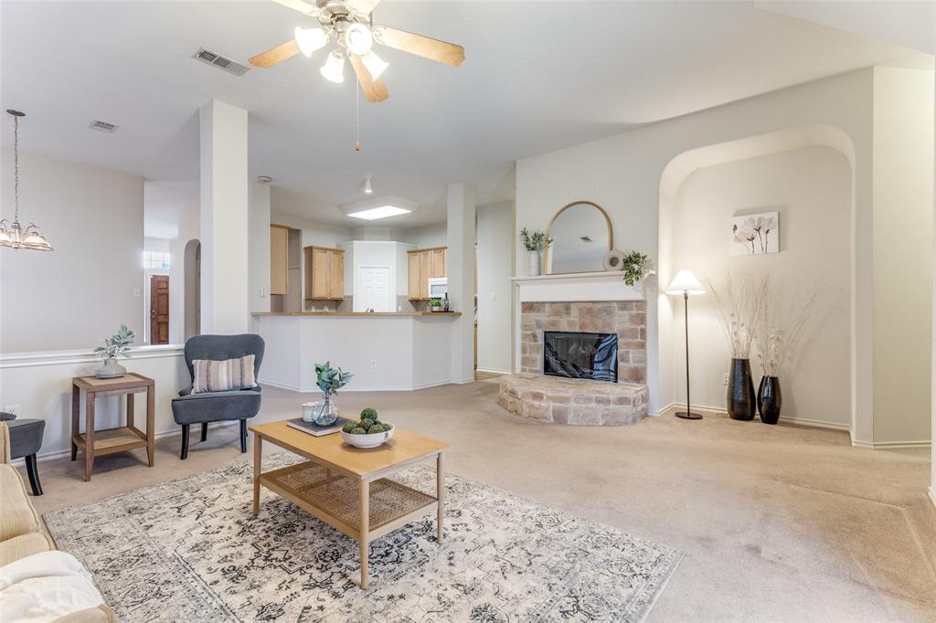 5213 Westheimer Road Fort Worth, TX 76244 - Photo 4 of 25 a living room with furniture and a fireplace
