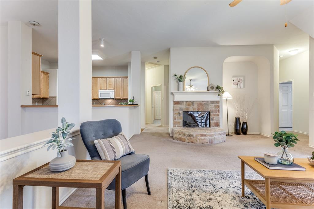 5213 Westheimer Road Fort Worth, TX 76244 - Photo 6 of 25 a living room with furniture and a fireplace