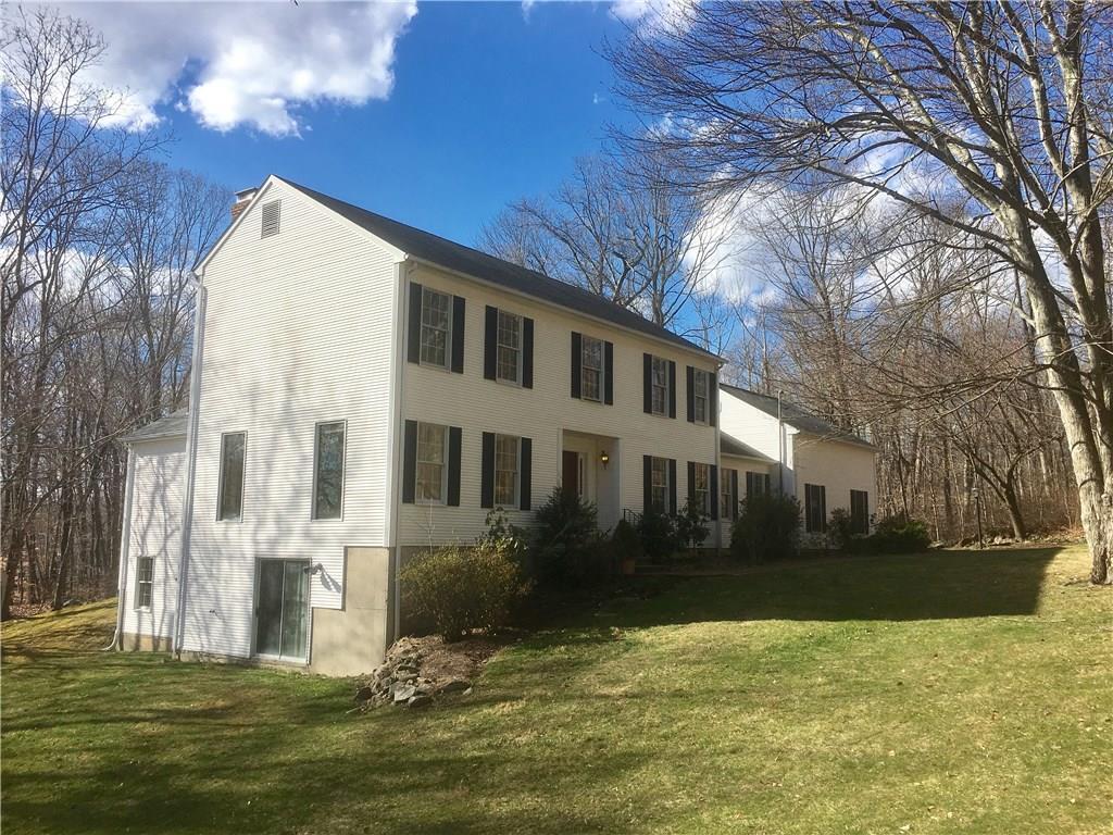 5 Wagon Wheel Road Redding, CT 06896 - Photo 1 of 1 a front view of a house with a yard