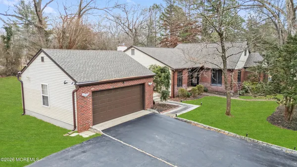 an aerial view of a house with swimming pool