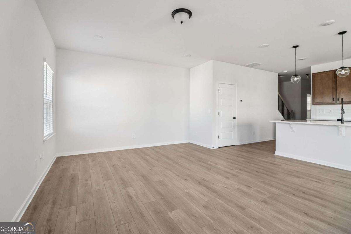 708 Shetland Trail Cartersville, GA 30121 - Photo 14 of 56 a view of a kitchen with a sink and a refrigerator