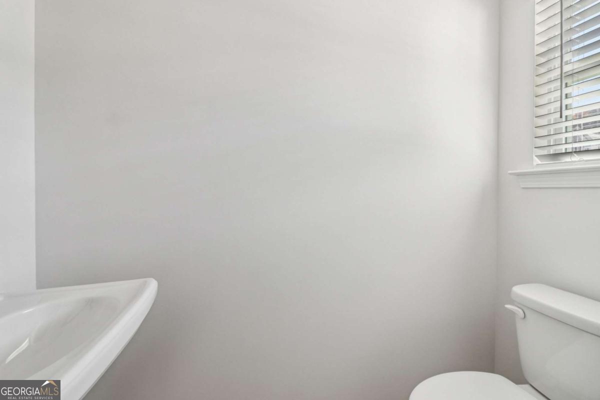 708 Shetland Trail Cartersville, GA 30121 - Photo 18 of 56 a white toilet sitting next to a white sink