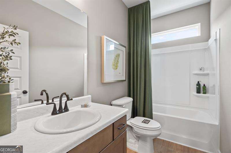 708 Shetland Trail Cartersville, GA 30121 - Photo 21 of 54 a bathroom with a sink a toilet and shower