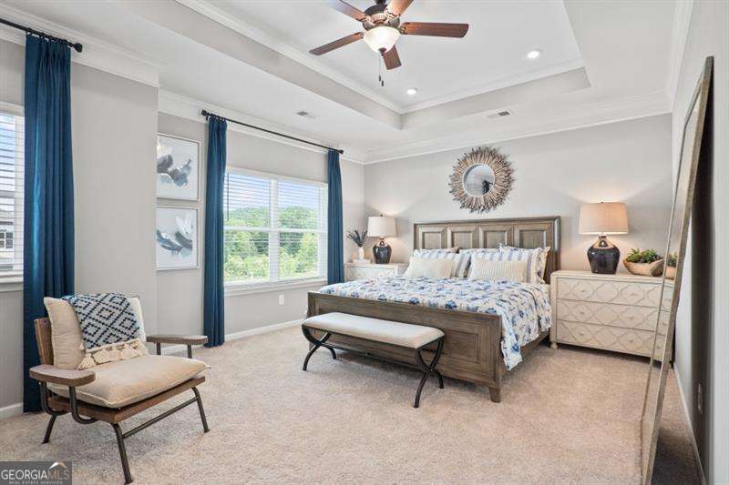 708 Shetland Trail Cartersville, GA 30121 - Photo 25 of 54 a bedroom with a bed and a chandelier