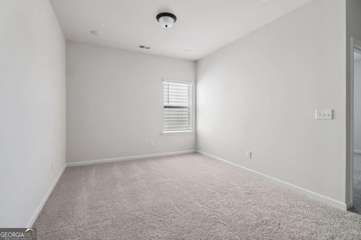 708 Shetland Trail Cartersville, GA 30121 - Photo 27 of 54 an empty room with windows