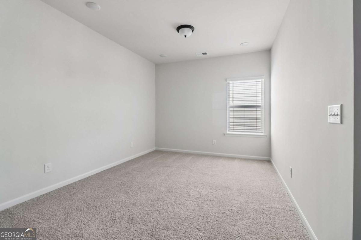 708 Shetland Trail Cartersville, GA 30121 - Photo 28 of 56 a view of an empty room with a window