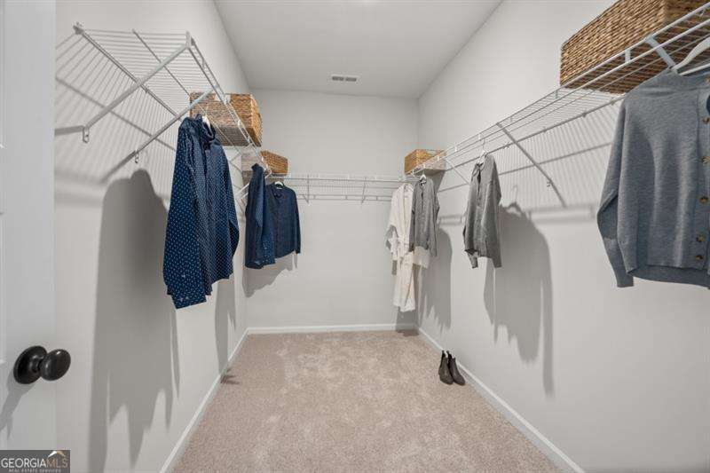 708 Shetland Trail Cartersville, GA 30121 - Photo 29 of 54 a view of walk in closet with clothes and shoes