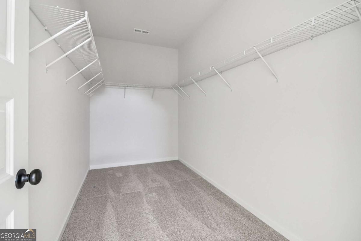 708 Shetland Trail Cartersville, GA 30121 - Photo 32 of 54 a view of a room with racks on the wall