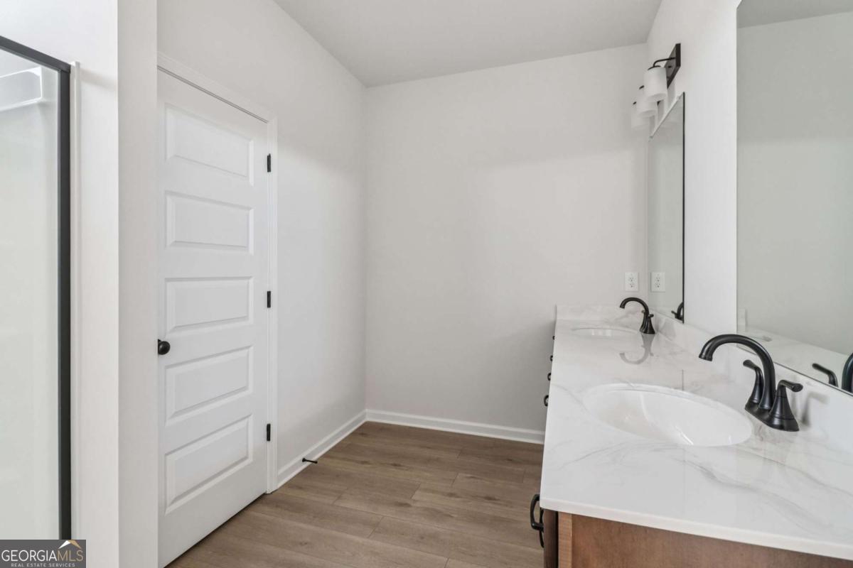 708 Shetland Trail Cartersville, GA 30121 - Photo 40 of 56 a bathroom with a sink and a mirror